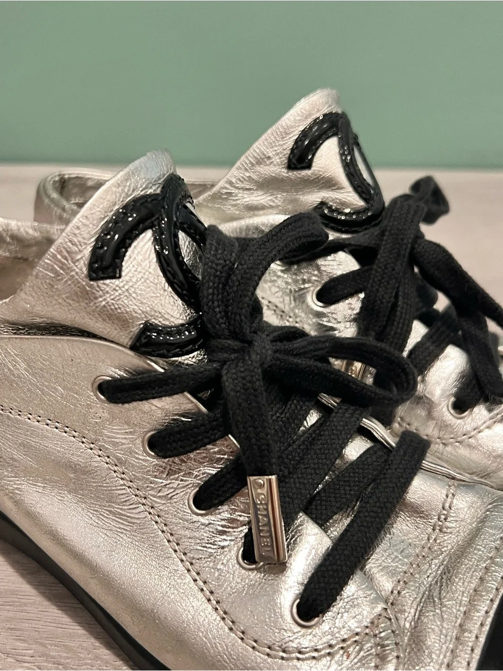 CHANEL Silver and Black Low-Top Lace-Up Sneaker